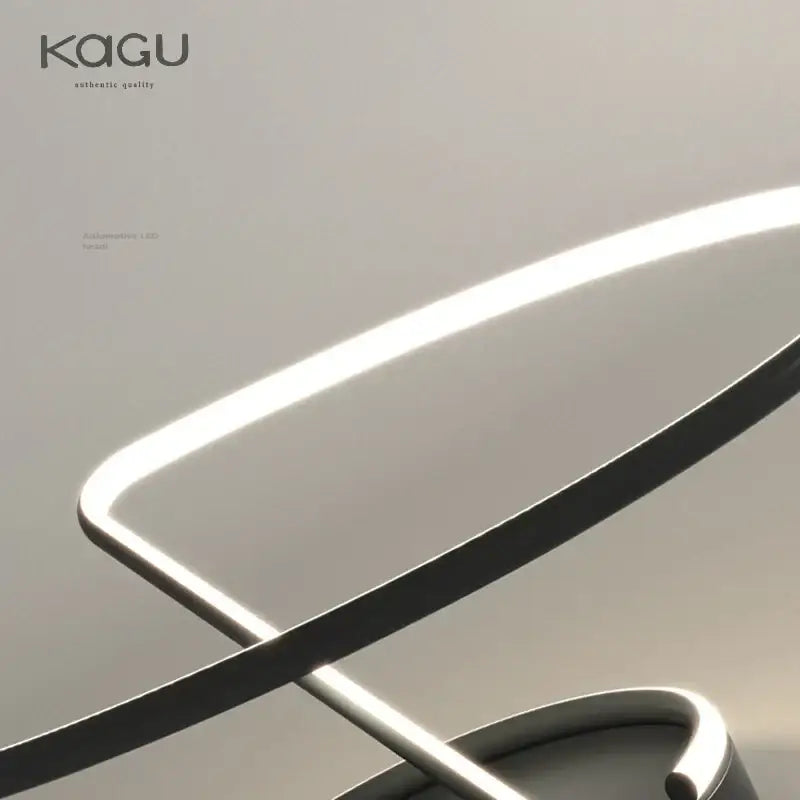 A sleek decorbites led chandelier chrome lamp with minimalist curved frame and soft white illumination for home decor