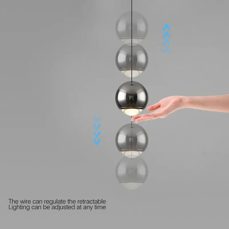 Modern minimalist decorbites led chandelier with four frosted and mirrored glass orbs in chrome gold finish suspension