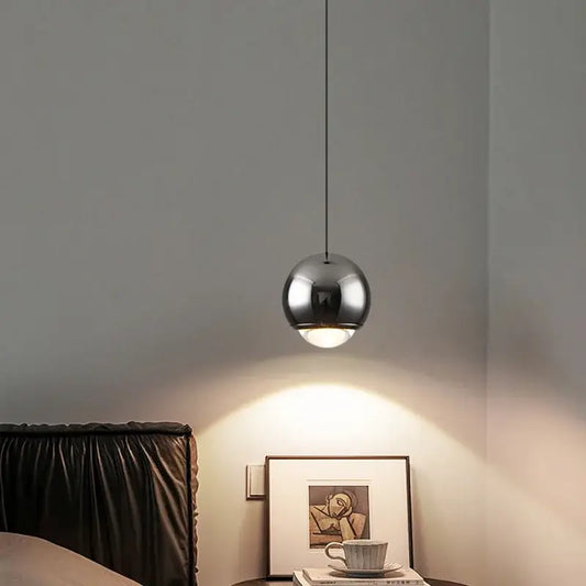 A sleek spherical chrome modern pendant light with minimal design from DecorBites LED chandelier collection