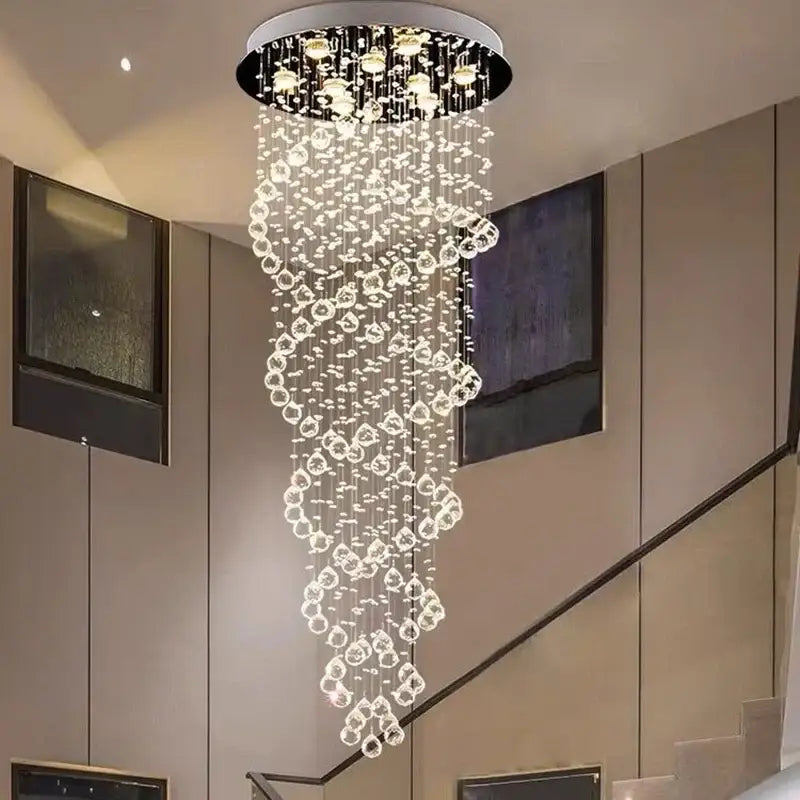 A modern circular decorbites led chandelier with cascading clear crystal beads and warm led lights for luxury decor