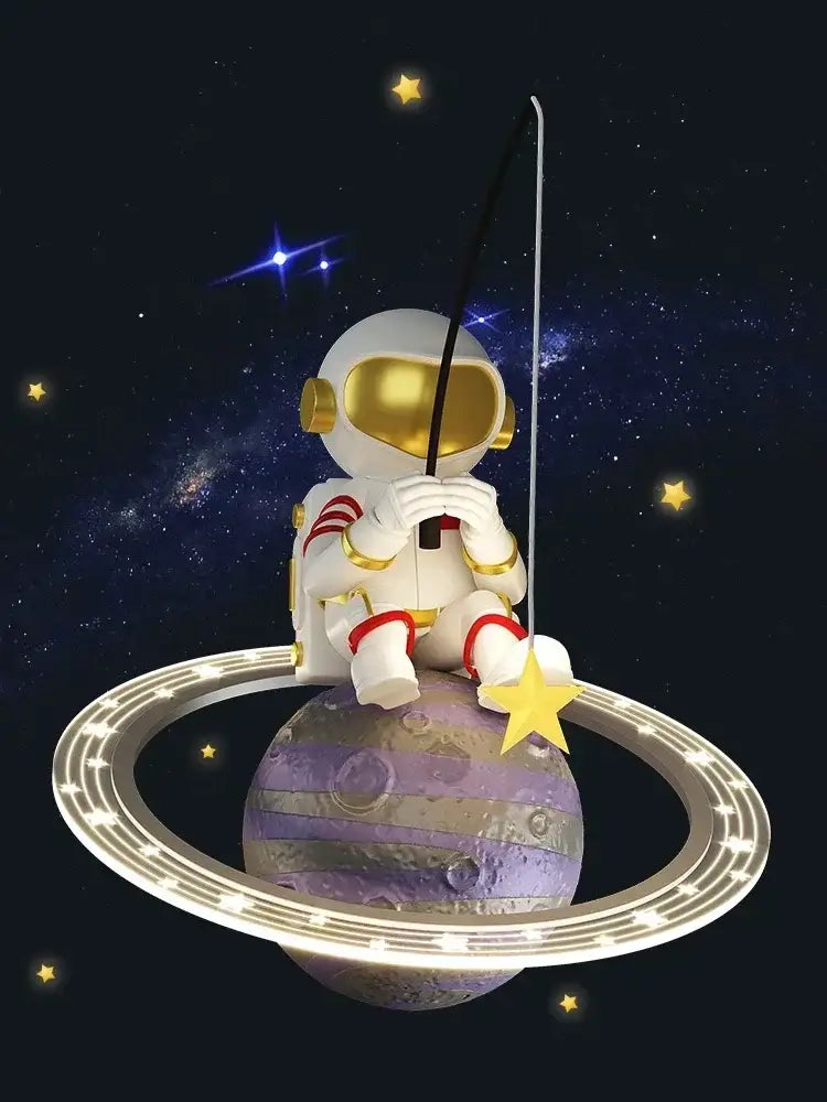 A white and gold astronaut figurine with red accents on a purple planet decorates the DecorBites LED chandelier for boys room