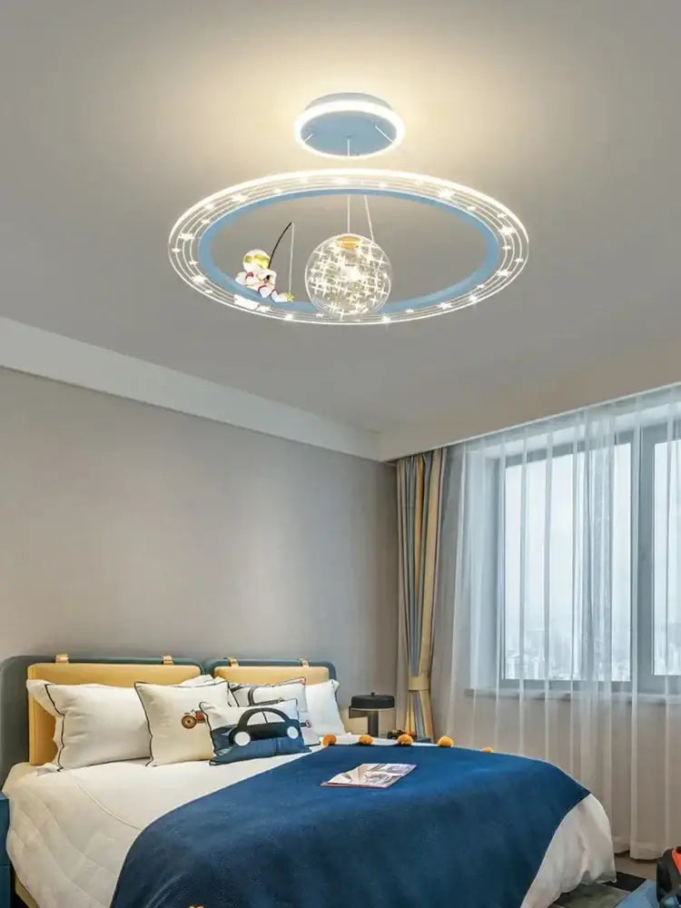 Decorbites led chandelier featuring a blue circular ceiling light with a cartoon character fishing and a sparkling globe pendant