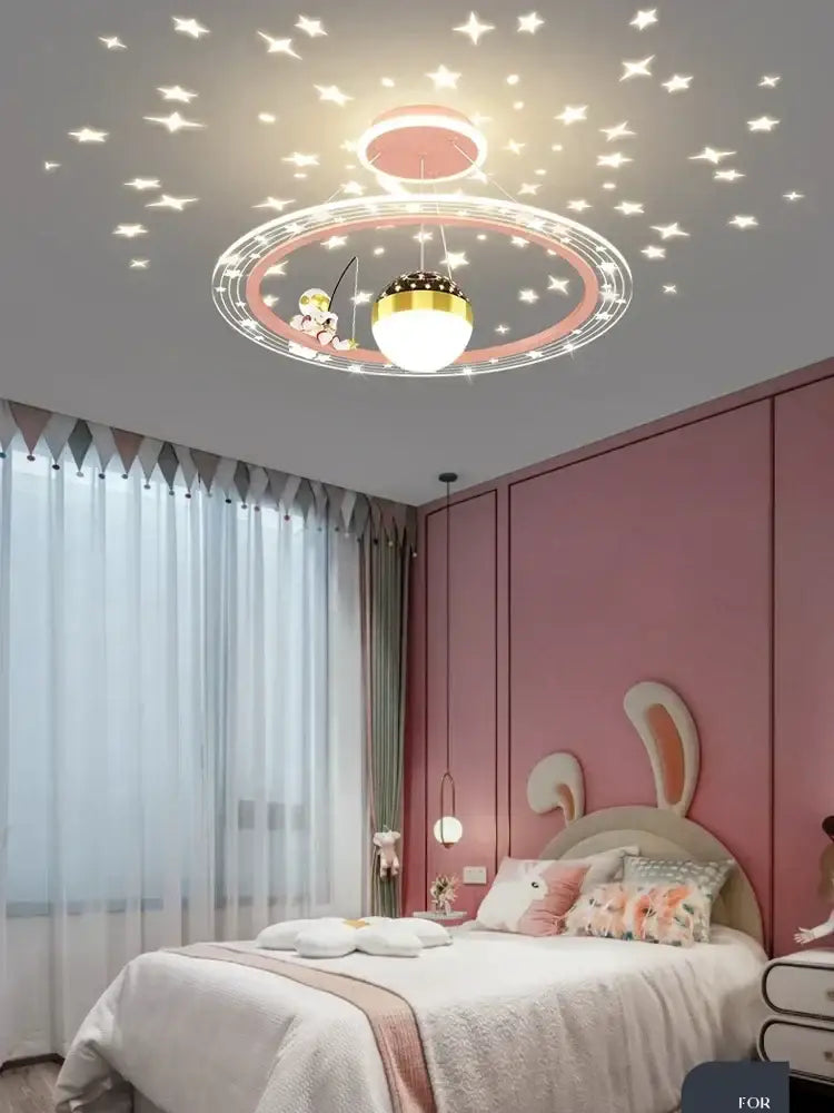 Decorbites led chandelier with pink and gold circular design featuring a cartoon fishing boat and glowing star decals for boys room