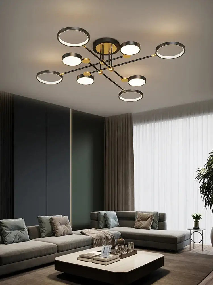 Modern black and gold circular decorbites led chandelier with multiple illuminated rings for living and dining rooms