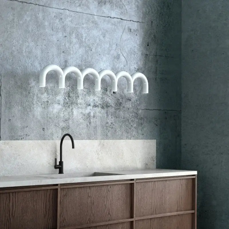 White curved pipe-style wall-mounted led chandelier with modern industrial design for living room by decorbites led chandelier