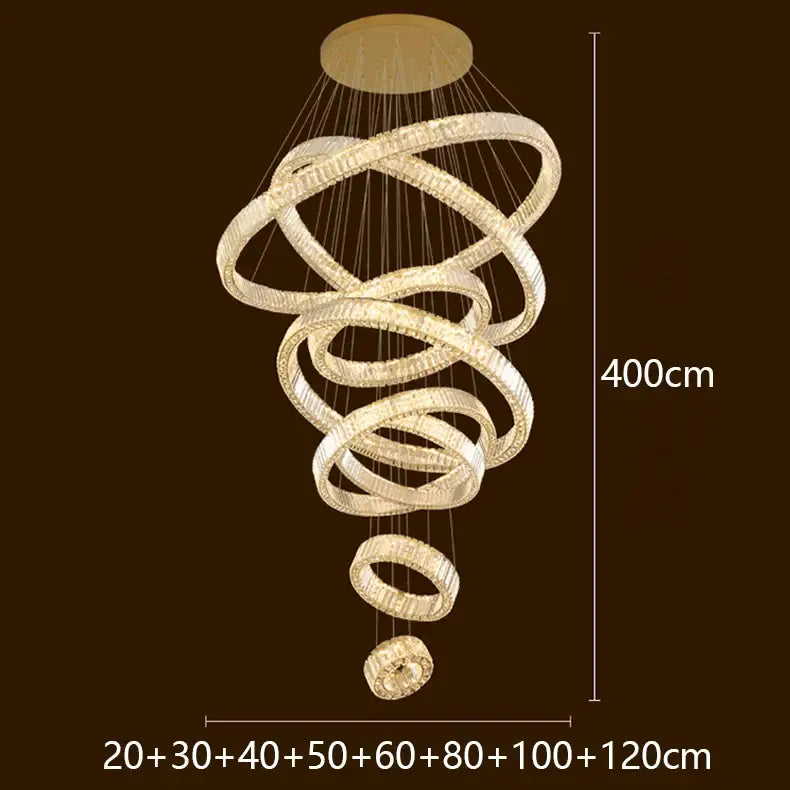 A modern DecorBites LED chandelier with interlocking rings and sparkling crystals emitting warm golden light