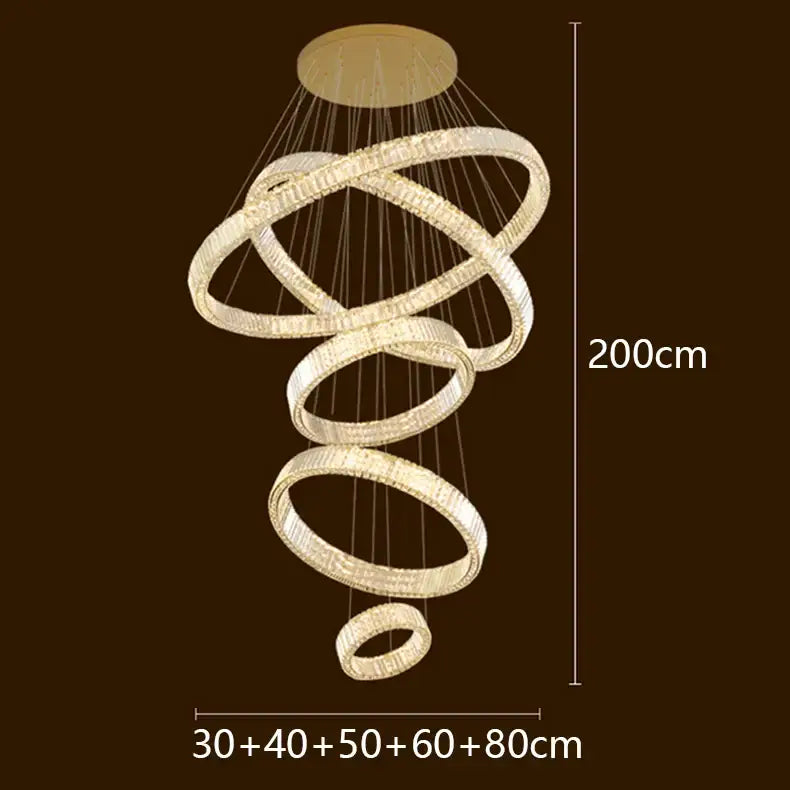 A modern spiral-shaped DecorBites LED chandelier with glowing crystal-encrusted metal rings for elegant lighting