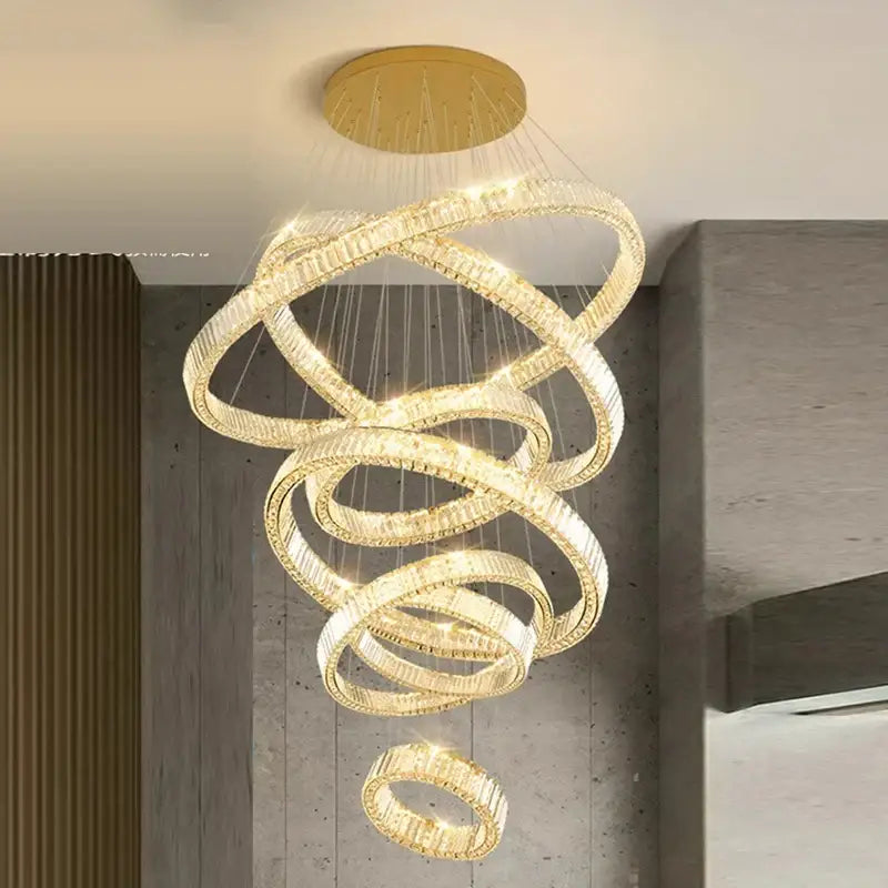 Golden spiral DecorBites led chandelier with interlocking crystal rings for modern bedroom and living room decor lighting