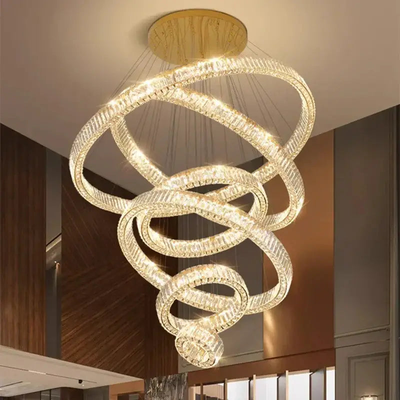 Modern multi-tiered DecorBites LED chandelier with interlocking crystal rings and gold-toned ceiling mount for living room lighting