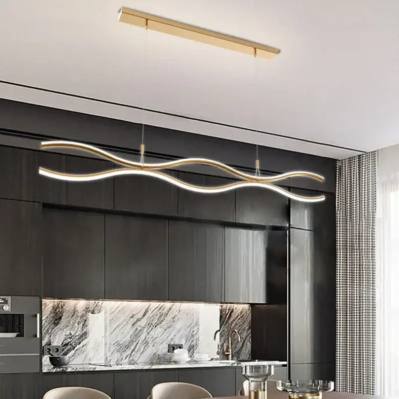 Gold-toned decorbites led chandelier pendant light with modern wave shape and integrated led for dining or bar table