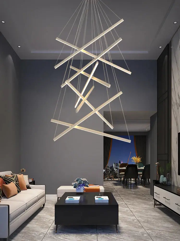 Modern geometric DecorBites LED chandelier with intersecting white LED bars suspended by thin cords for loft decor