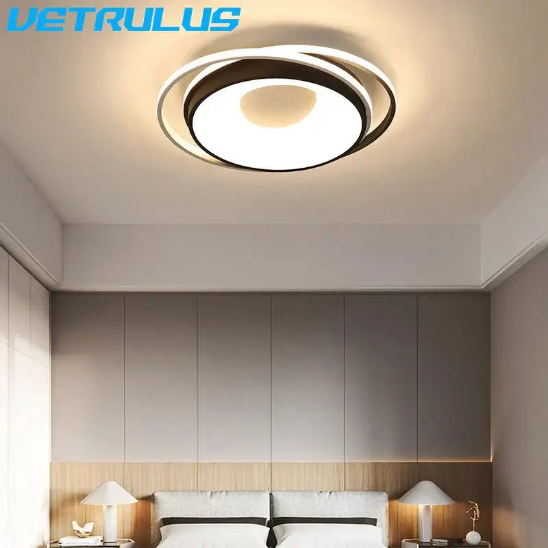 Modern acrylic decorbites led chandelier light with black and white concentric rings emitting warm glow for living room
