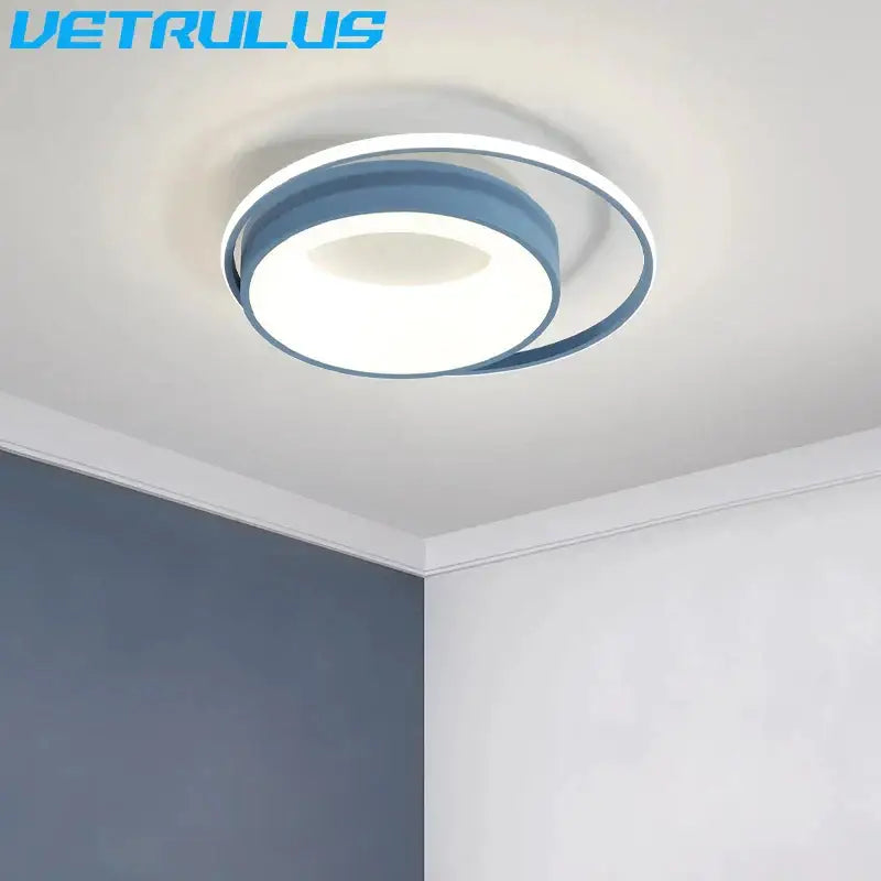 Modern decorbites led chandelier with sleek blue metallic ring and white acrylic center for living and dining rooms