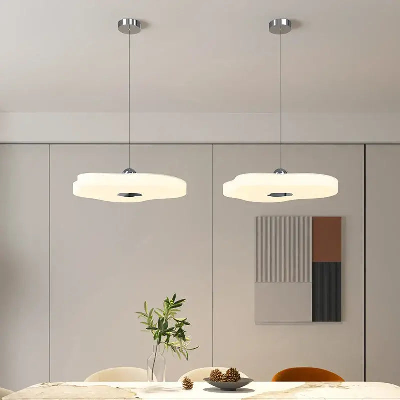 Two cloud shaped pendant lights with soft white diffuser and chrome fixtures in decorbites led chandelier design