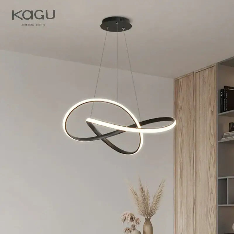 Decorbites led chandelier light features a black and white infinity loop design in aluminum and acrylic for modern dining