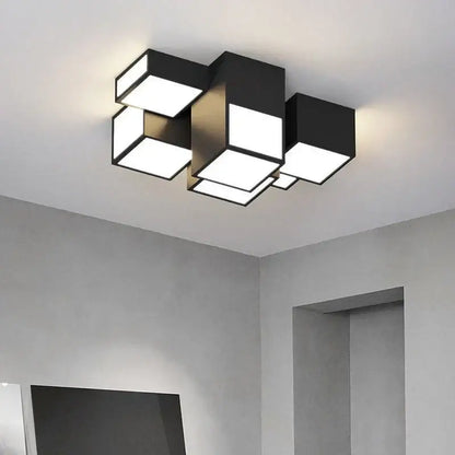 Modern black cube decorbites led chandelier with illuminated white panels and remote dimming for minimalist indoor lighting