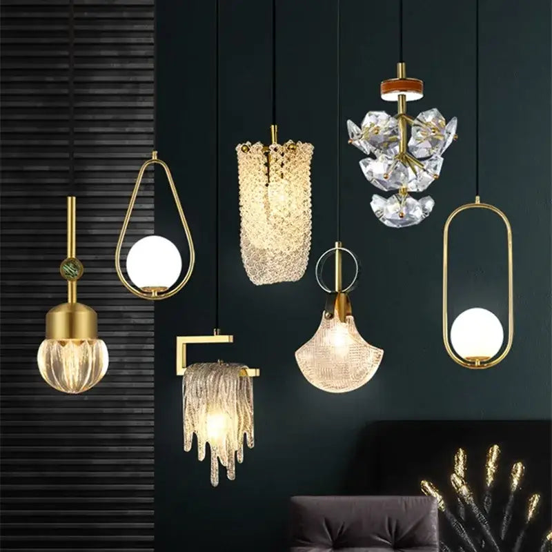 A collection of modern gold-toned decorbites led chandelier lights with crystal and glass shades for dining room