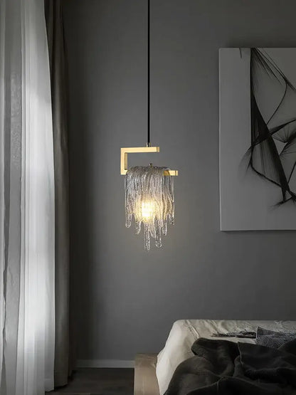 A modern decorbites led chandelier with gold-toned square frame and cascading clear glass chains for dining room