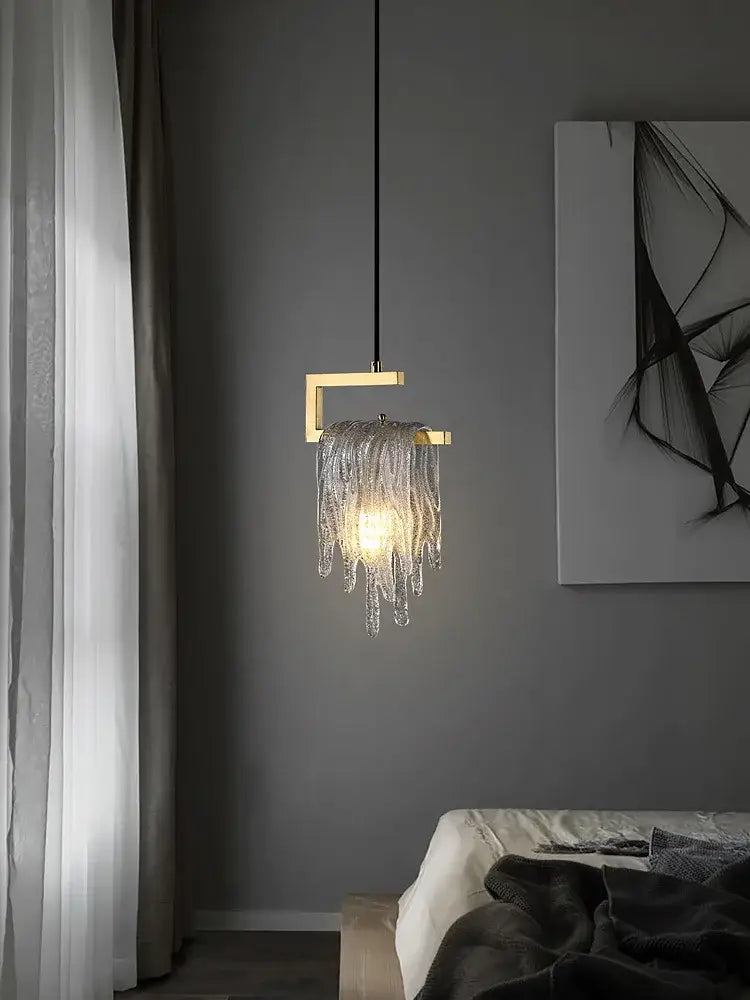 A modern decorbites led chandelier with gold-toned square frame and cascading clear glass chains for dining room