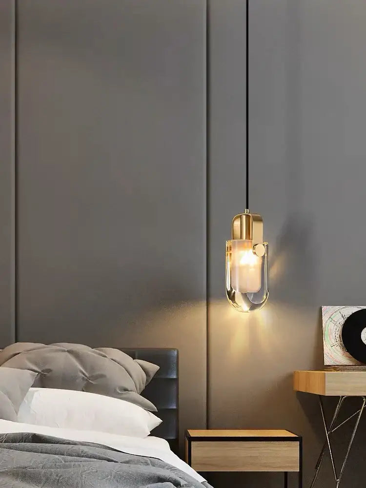 A modern decorbites led chandelier with gold-toned metal frame and clear glass pendant for dining room lighting