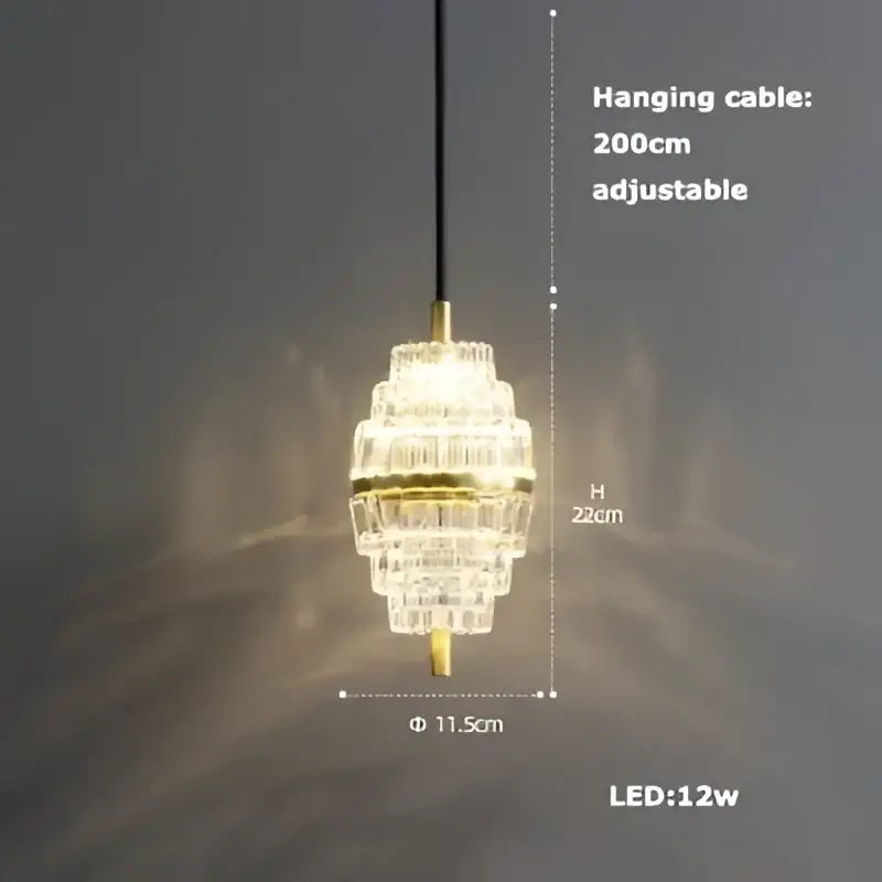 A tiered DecorBites LED chandelier with crystal and gold-toned metal accents for dining room lighting