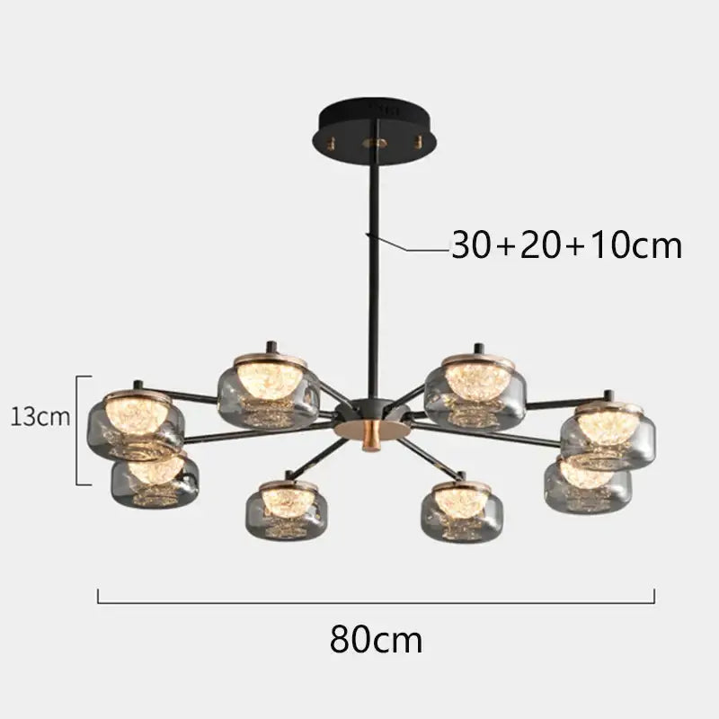 Modern black and brass decorbites led chandelier with eight clear glass globes for living and dining rooms