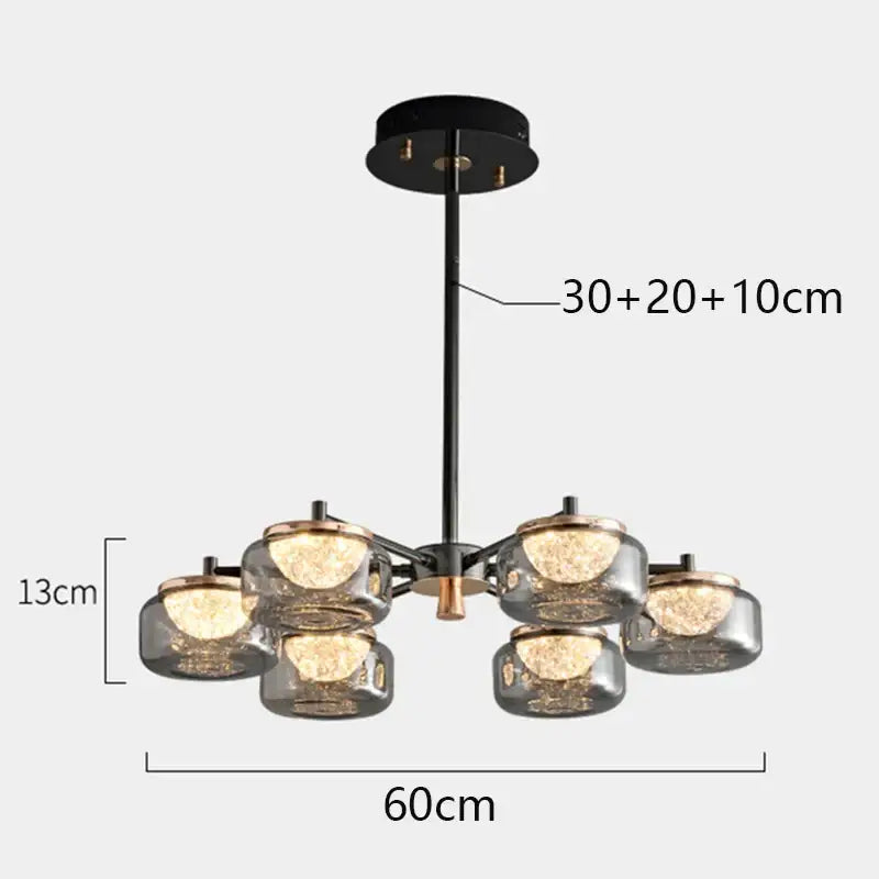 Modern black metal decorbites led chandelier with six frosted glass globe shades and brass accents for living room lighting