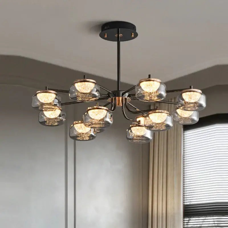 Modern decorbites led chandelier lighting with black metal frame and clear glass globe shades for living room use