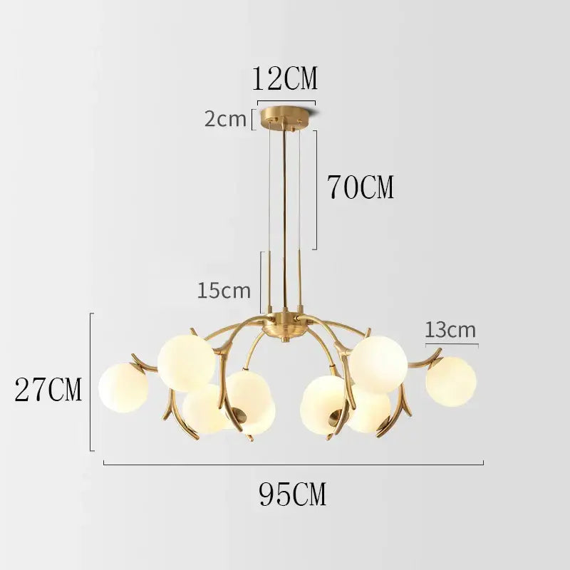 Gold-toned decorbites led chandelier lighting with six frosted glass globes for living room bedroom and dining room décor
