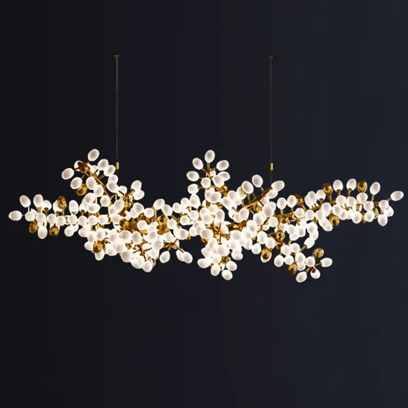 Gold-toned decorbites led chandelier lighting with frosted glass globe bulbs in a branching design for living room decor