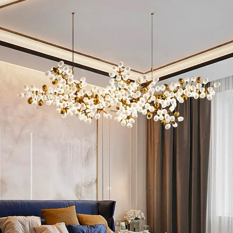 Gold-toned decorbites led chandelier lighting with frosted glass globes in branching design for living room decor