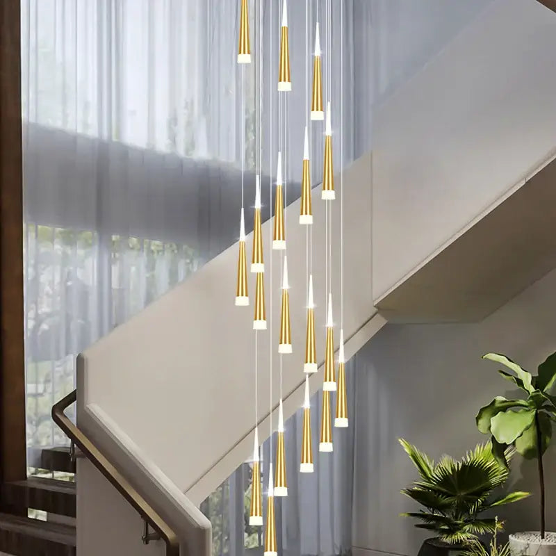 Modern gold-toned decorbites led chandelier with tapered cylindrical lights for staircase duplex and villa attic lighting