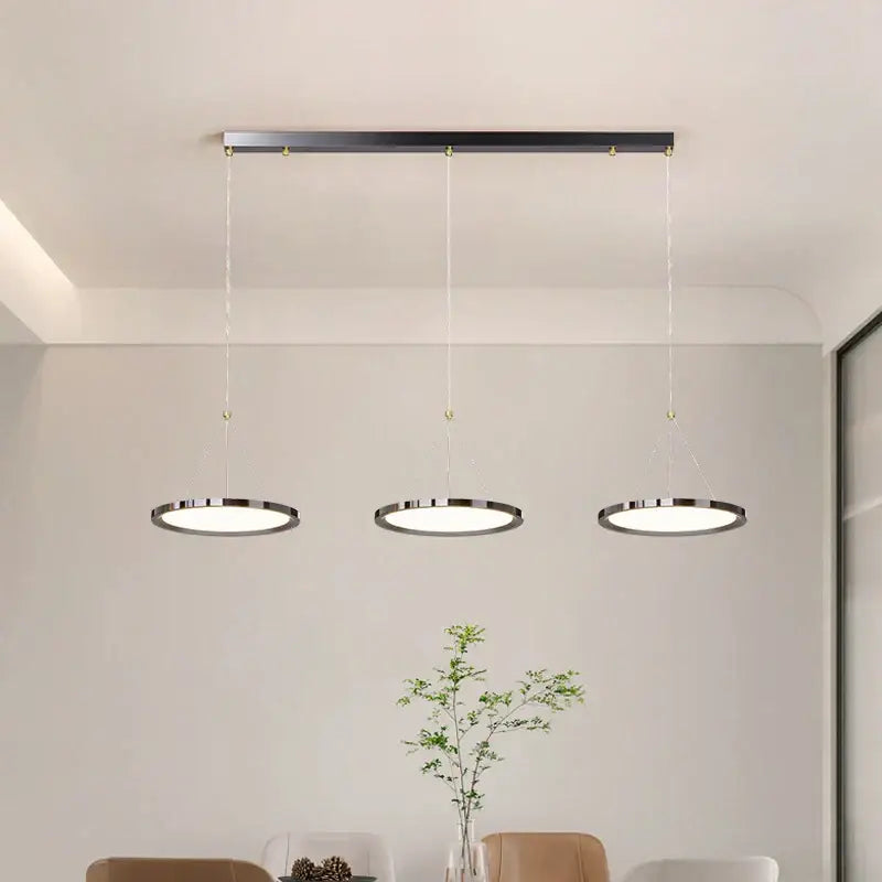 Modern minimalist decorbites led chandelier with sleek circular matte black shades for indoor living and dining rooms