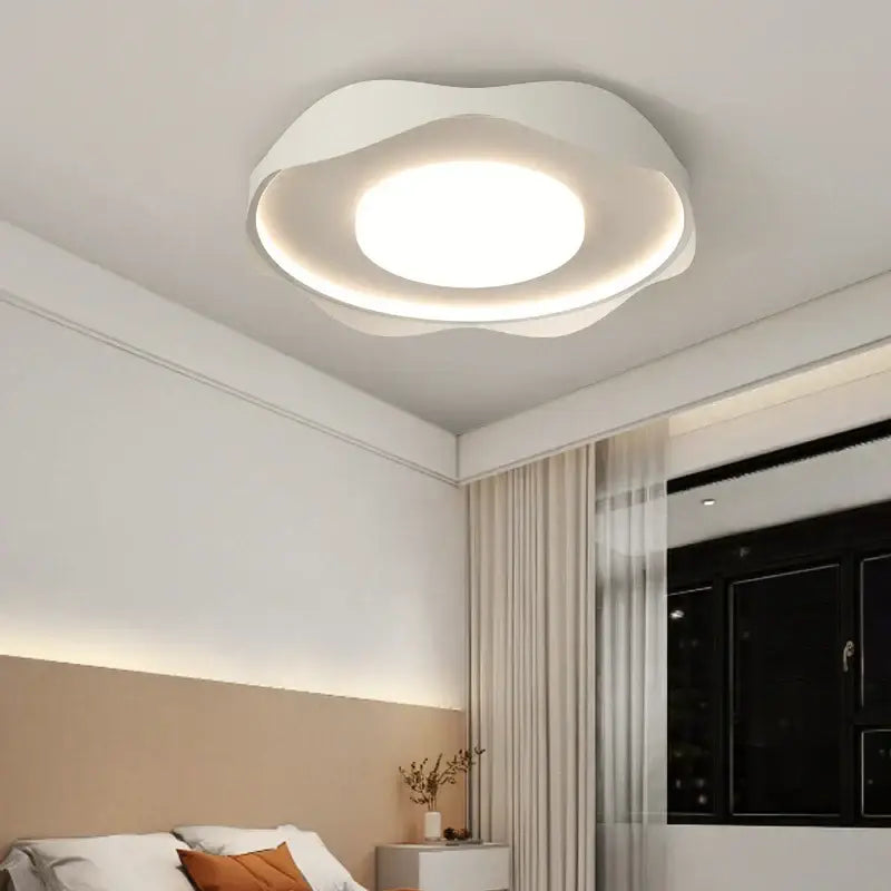 White modern DecorBites LED chandelier with soft cloud-like design and circular illumination for indoor lighting