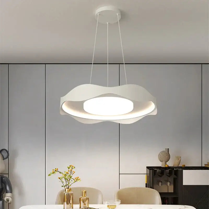 Modern white DecorBites LED chandelier with sleek layered circular design and soft ambient glow for indoor lighting