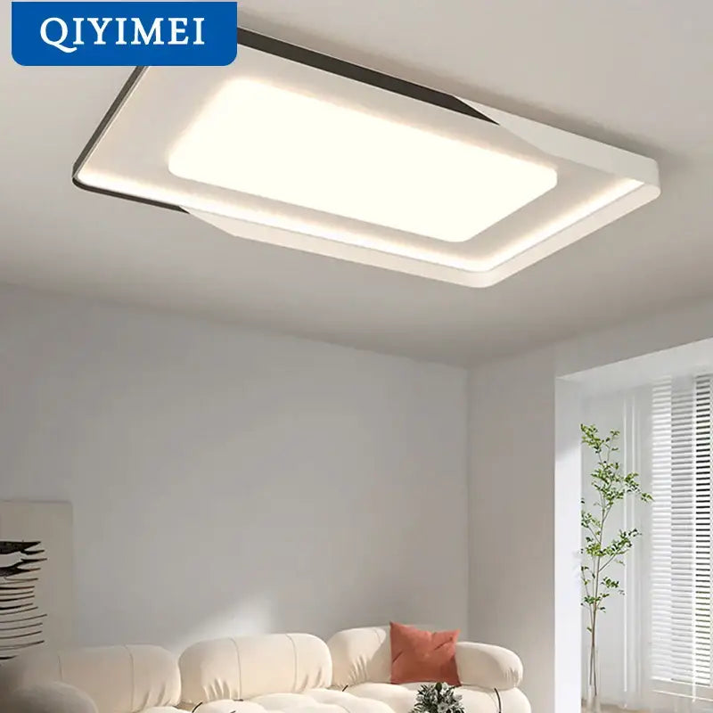Modern rectangular decorbites led chandelier with sleek white and black frame emitting soft ambient light for indoor decor
