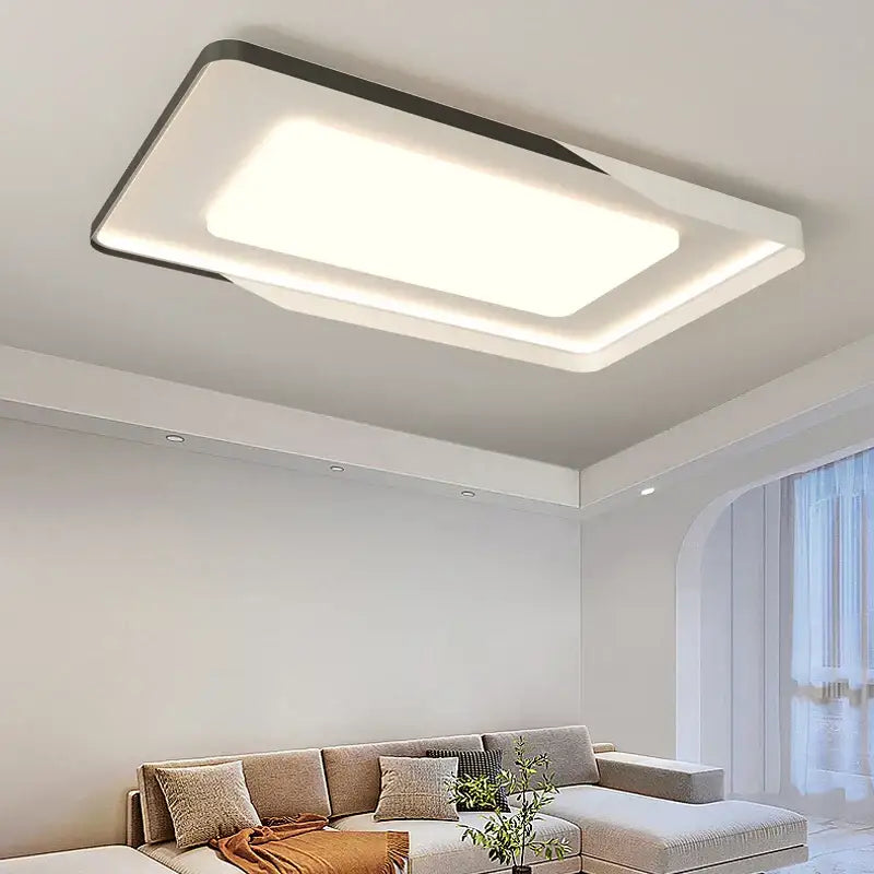 Modern rectangular decorbites led chandelier with white and black frame emitting soft ambient light for indoor use