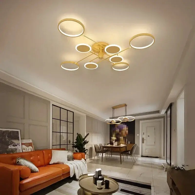 Modern gold-toned decorbites led chandelier with multiple circular rings for living room bedroom and kitchen lighting