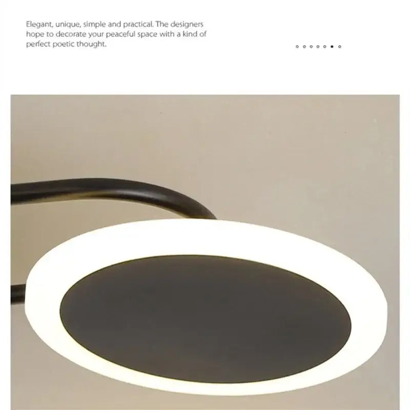Modern minimalist decorbites led chandelier with a sleek black curved arm and glowing white led ring for home decor
