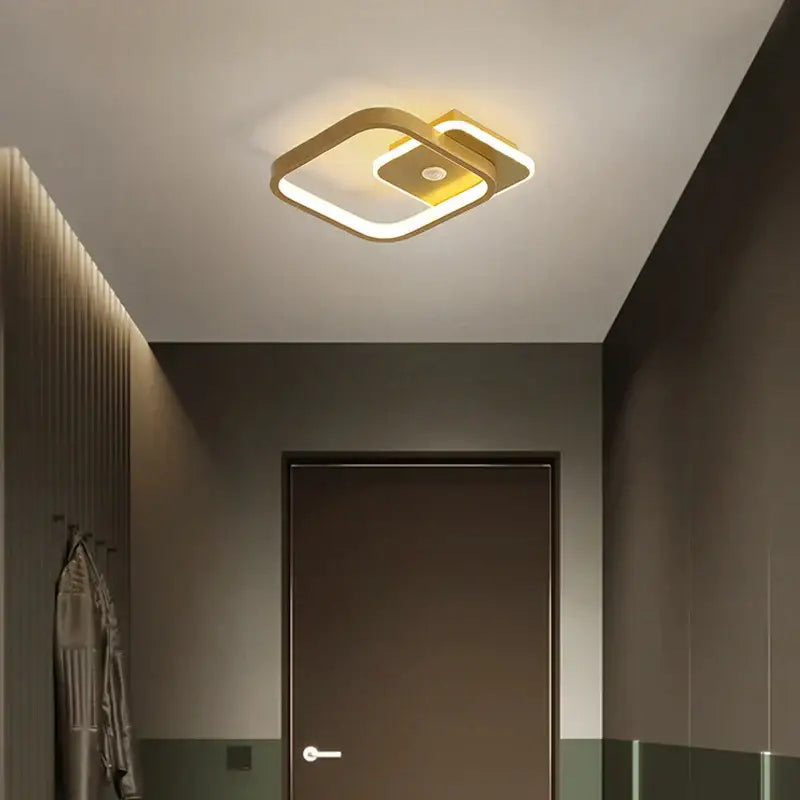 Modern gold-finished decorbites led chandelier with overlapping geometric design and integrated led lighting for indoor use