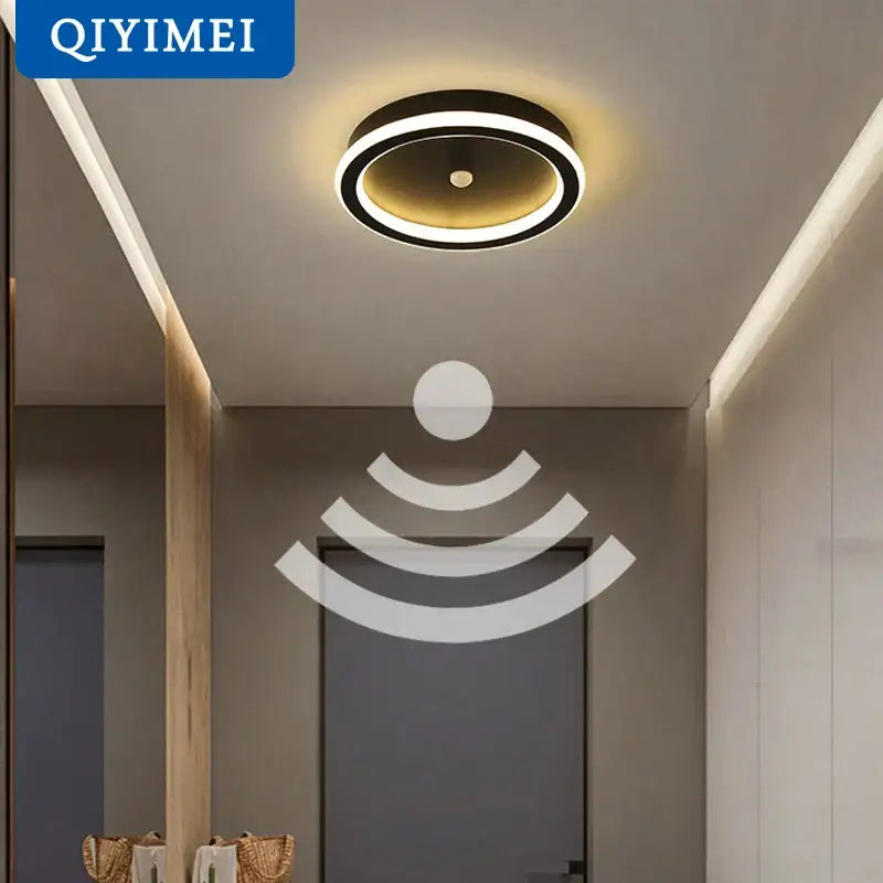 Modern circular decorbites led chandelier with black outer ring and warm golden led glow featuring pir motion sensor