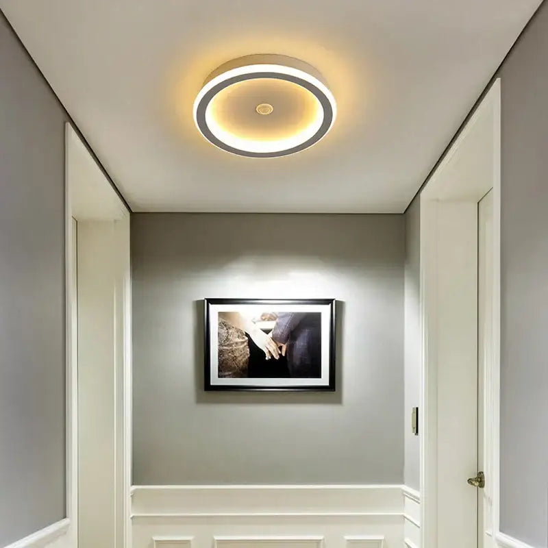 Circular decorbites led chandelier with two concentric rings dark frame and inner warm glow for indoor lighting with motion sensor