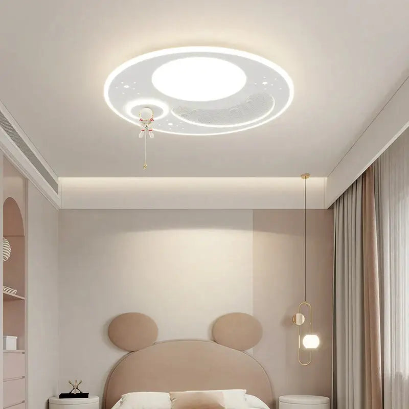 A white circular decorbites led chandelier featuring moon and star design with illuminated central circle for modern lighting