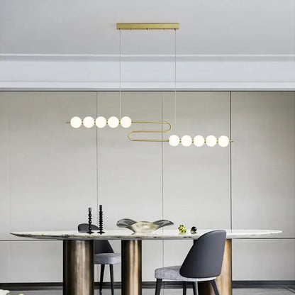 Gold-toned decorbites led chandelier necklace lighting with frosted glass spheres for dining room modern pendant light
