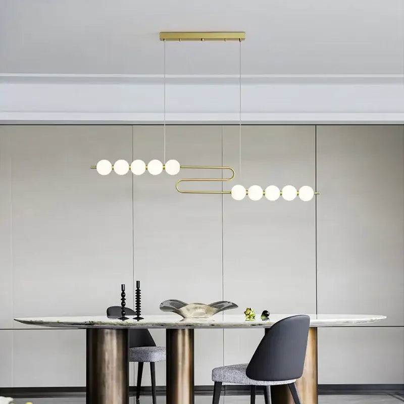 Gold-toned decorbites led chandelier necklace lighting with frosted glass spheres for dining room modern pendant light