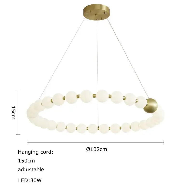 A modern decorbites led chandelier necklace lighting with frosted glass orbs and brass accents for dining room use