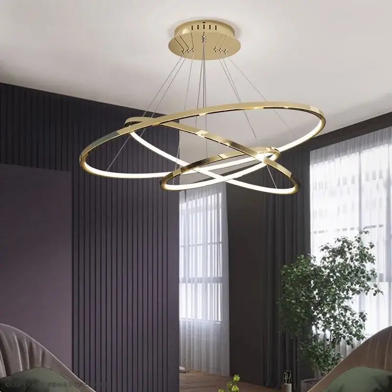 Gold-toned decorbites led chandelier pendant light with interlocking circular rings and integrated led lighting for indoor use