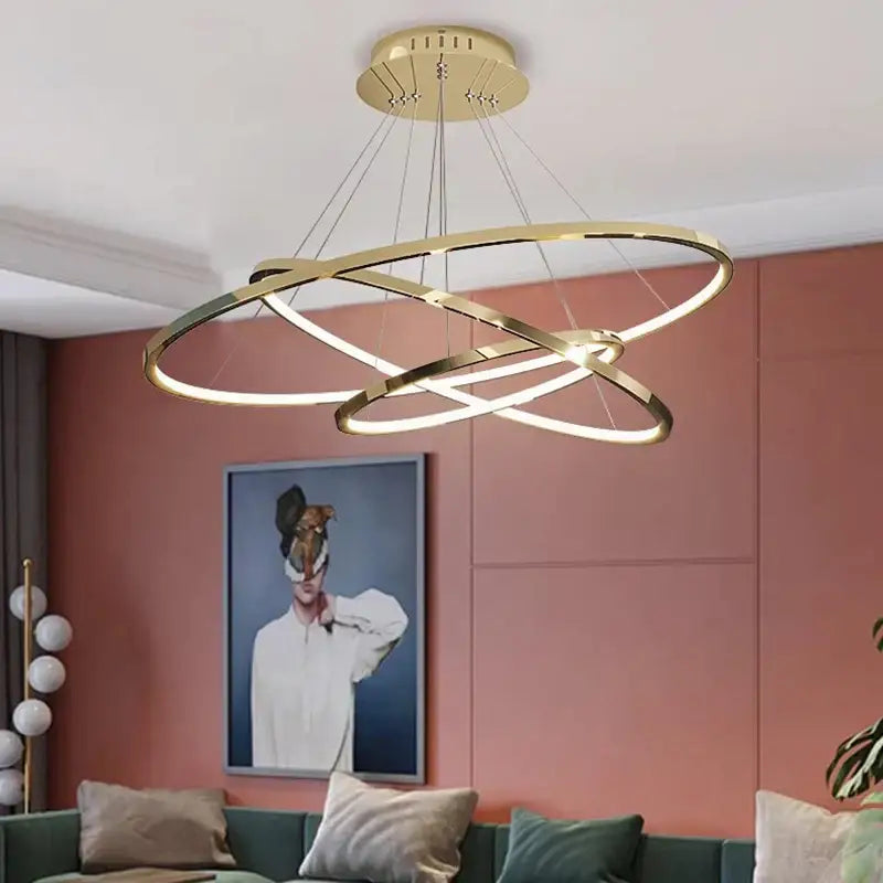 Gold-toned DecorBites LED chandelier pendant with interlocking rings and integrated LED lighting for indoor pendant light use