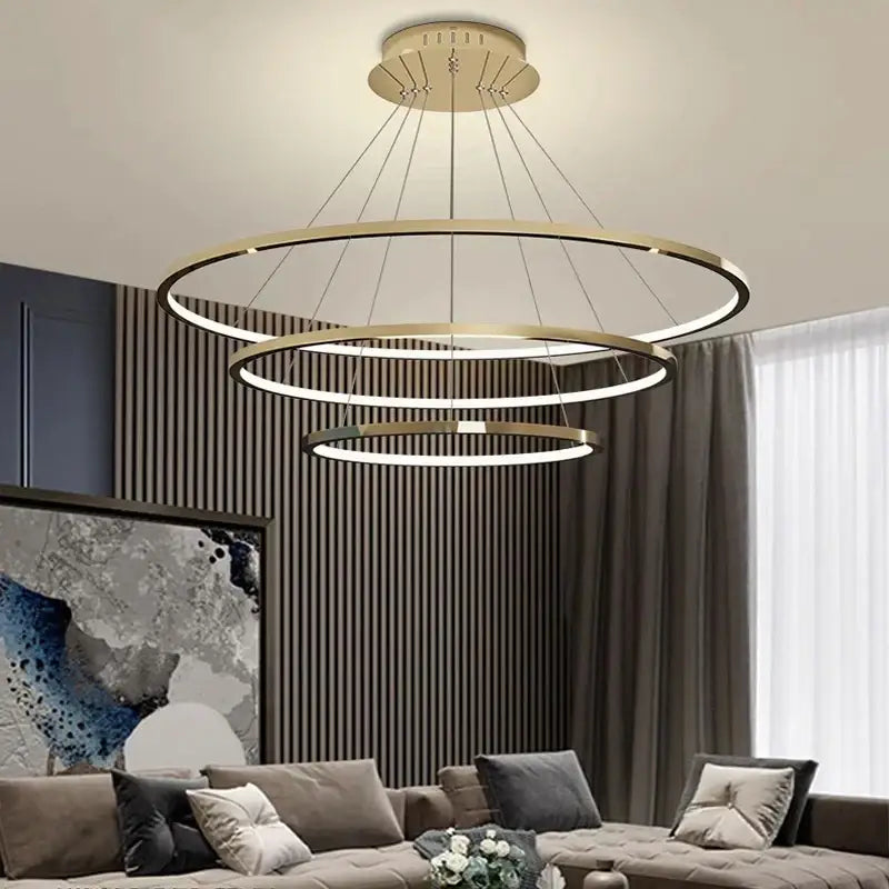 Modern gold-toned tiered decorbites led chandelier pendant light with sleek minimalist design for indoor living room lighting