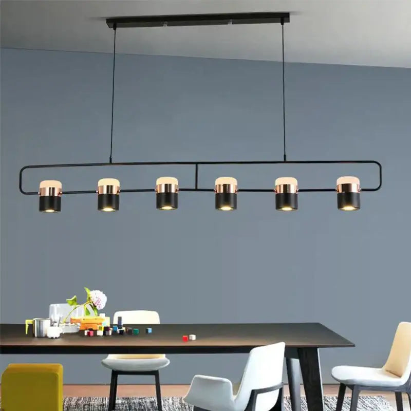 Modern black and brass DecorBites LED chandelier pendant lamp with five cylindrical bulbs for dining room and cafe lighting